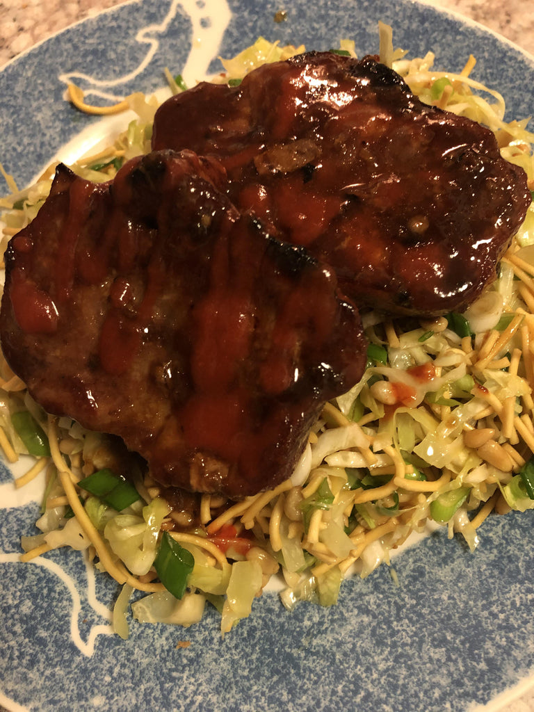 Asian grilled pork with cabbage noodle salad